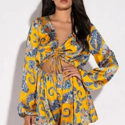 ADMIT IT LONG SLEEVE PRINTED ROMPER WITH CUT OUT