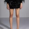 LIVING IT UP SATIN AND SPIKES FEATHER MINI SKIRT